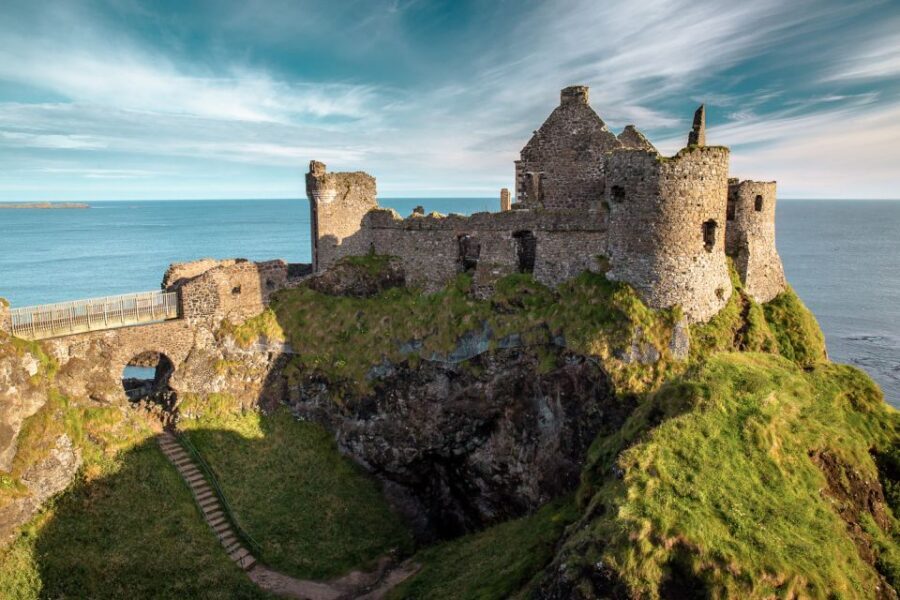 Dublin: Giants Causeway, Dark Hedges, Dunluce & Belfast Tour - The bus day reality: food, weather gear, and keeping your footing
