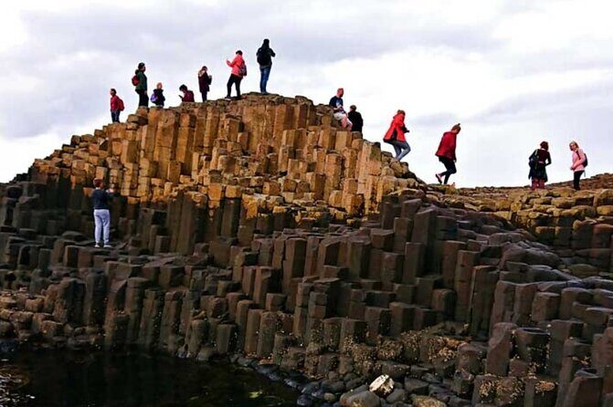 Giants Causeway with Private Chauffeur Day Tour from Dublin - Dunluce Castle: Romanesque Ruin Views and the Clan Drama That Lingers